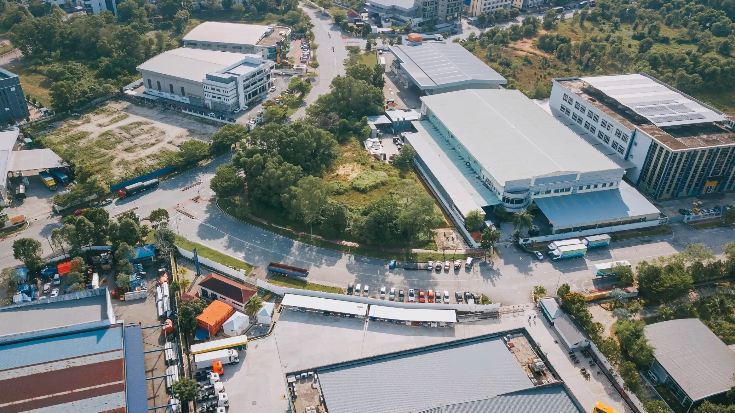 Aerial view of an industrial area showing facilities, and surrounding infrastructure. 