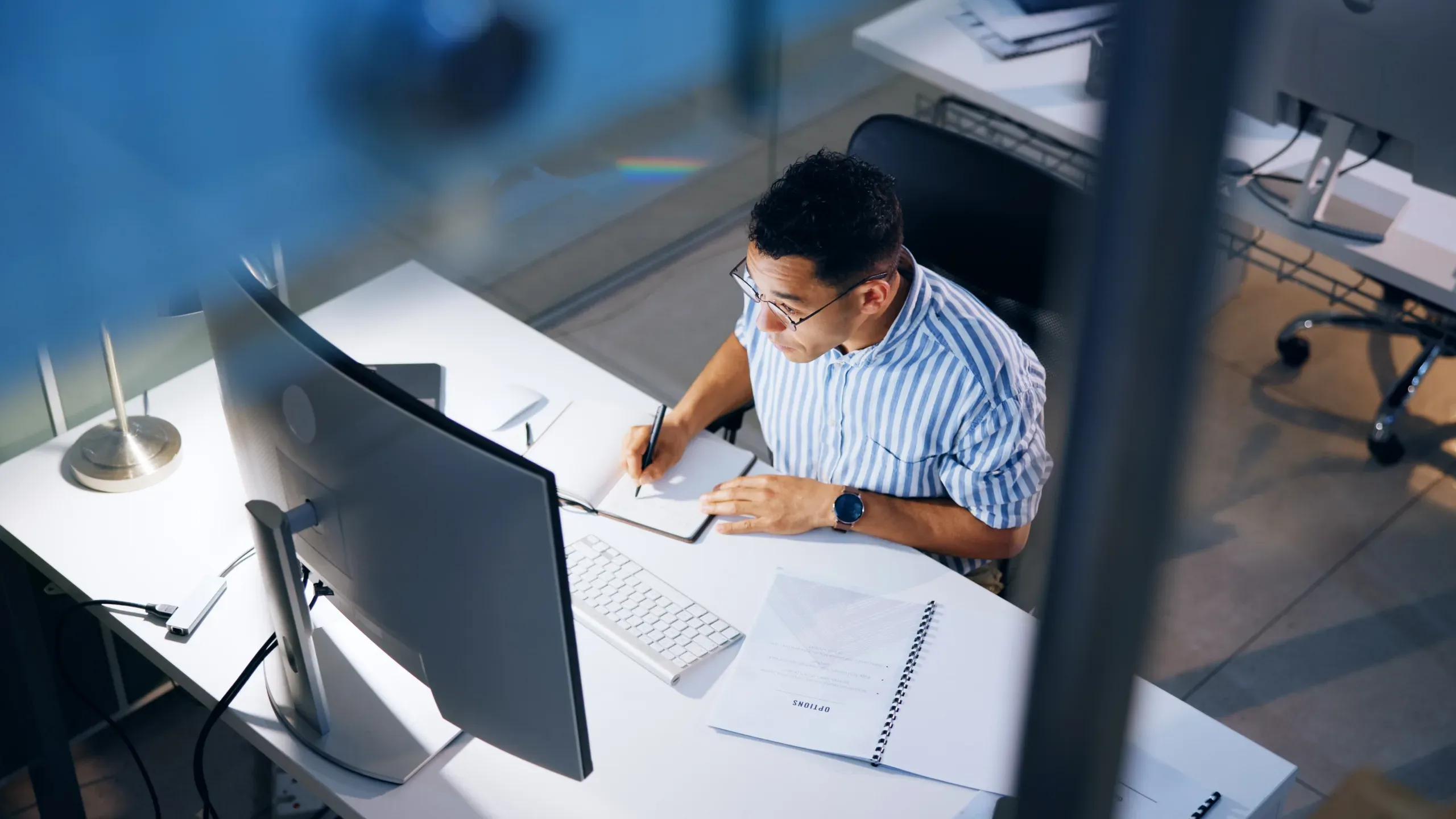Businessman working at a desk in front of a computer monitor