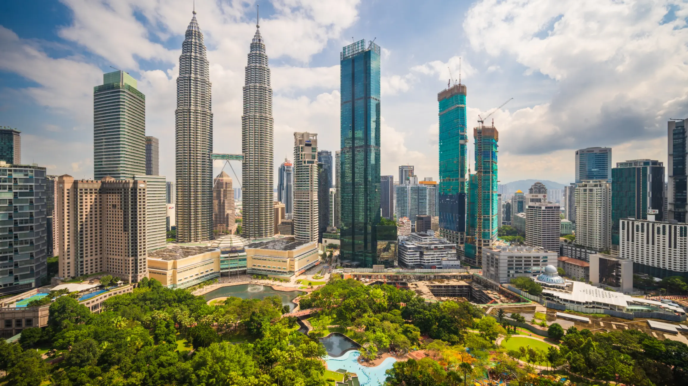 Kuala Lumpur city skyline featuring modern skyscrapers, iconic landmarks, and a dynamic urban landscape.