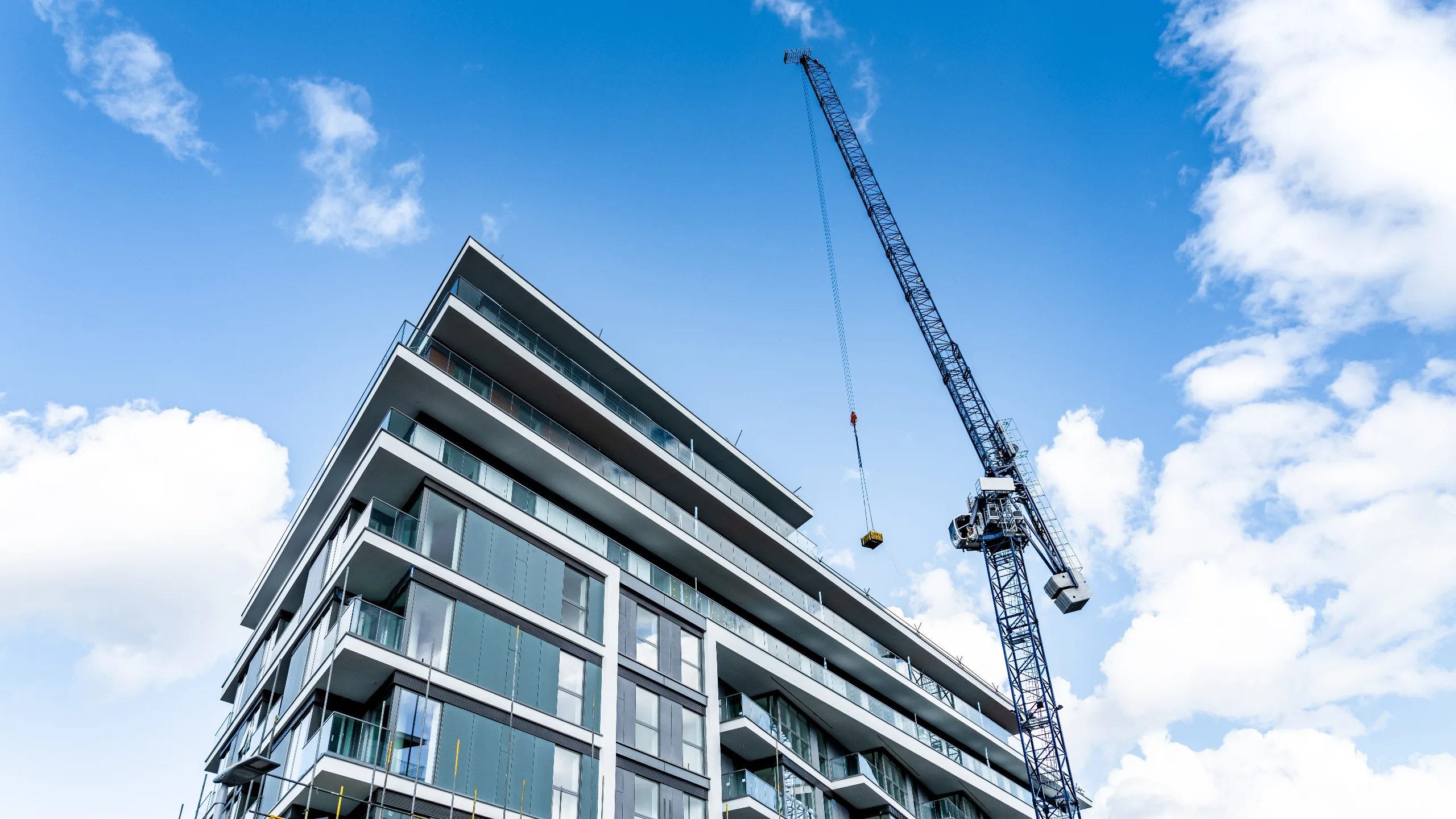 Construction site and development project featuring active building works, machinery, and emerging infrastructure. 