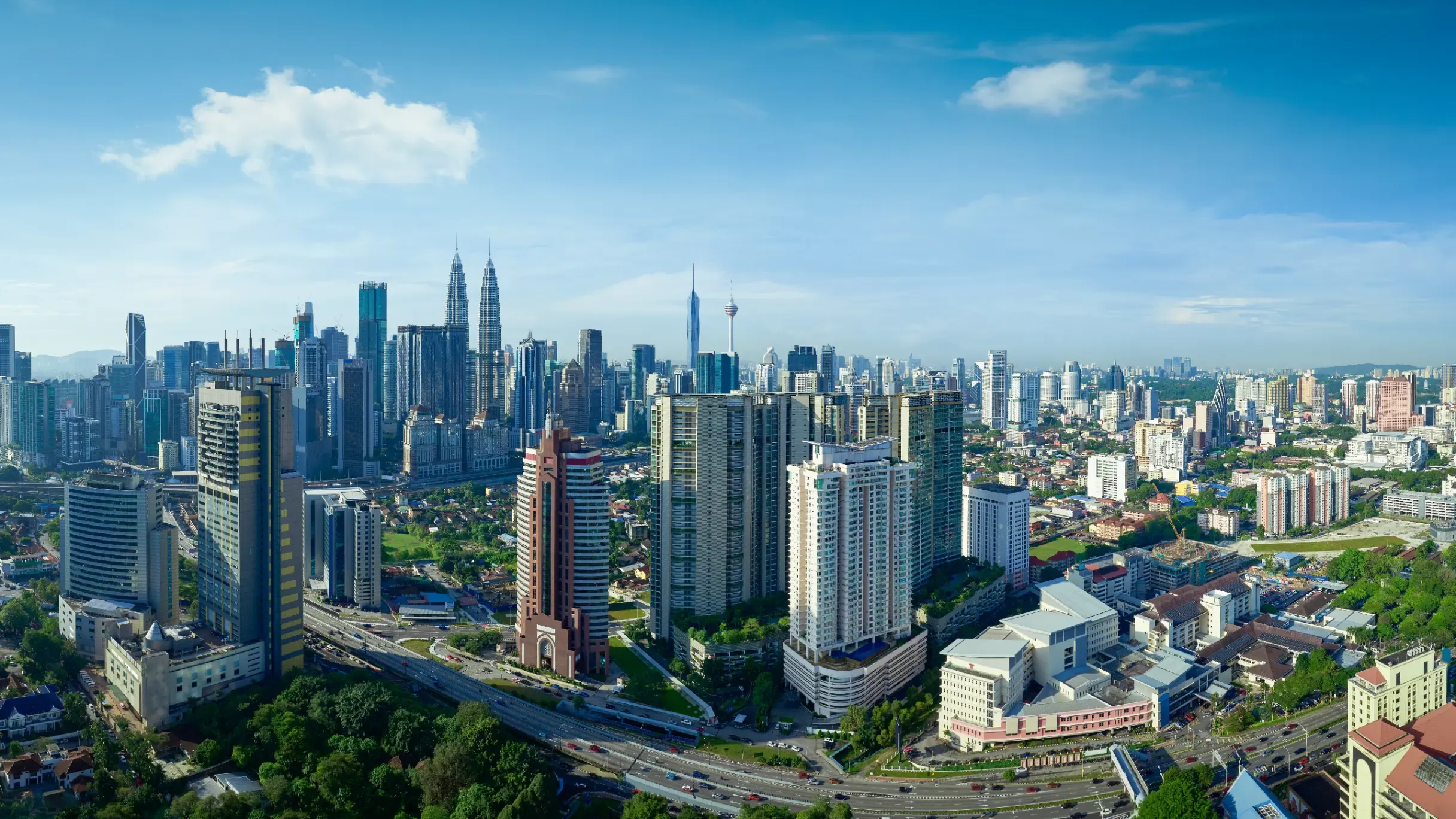 Kuala Lumpur city skyline featuring modern skyscrapers, urban landmarks, and a thriving metropolitan landscape. 