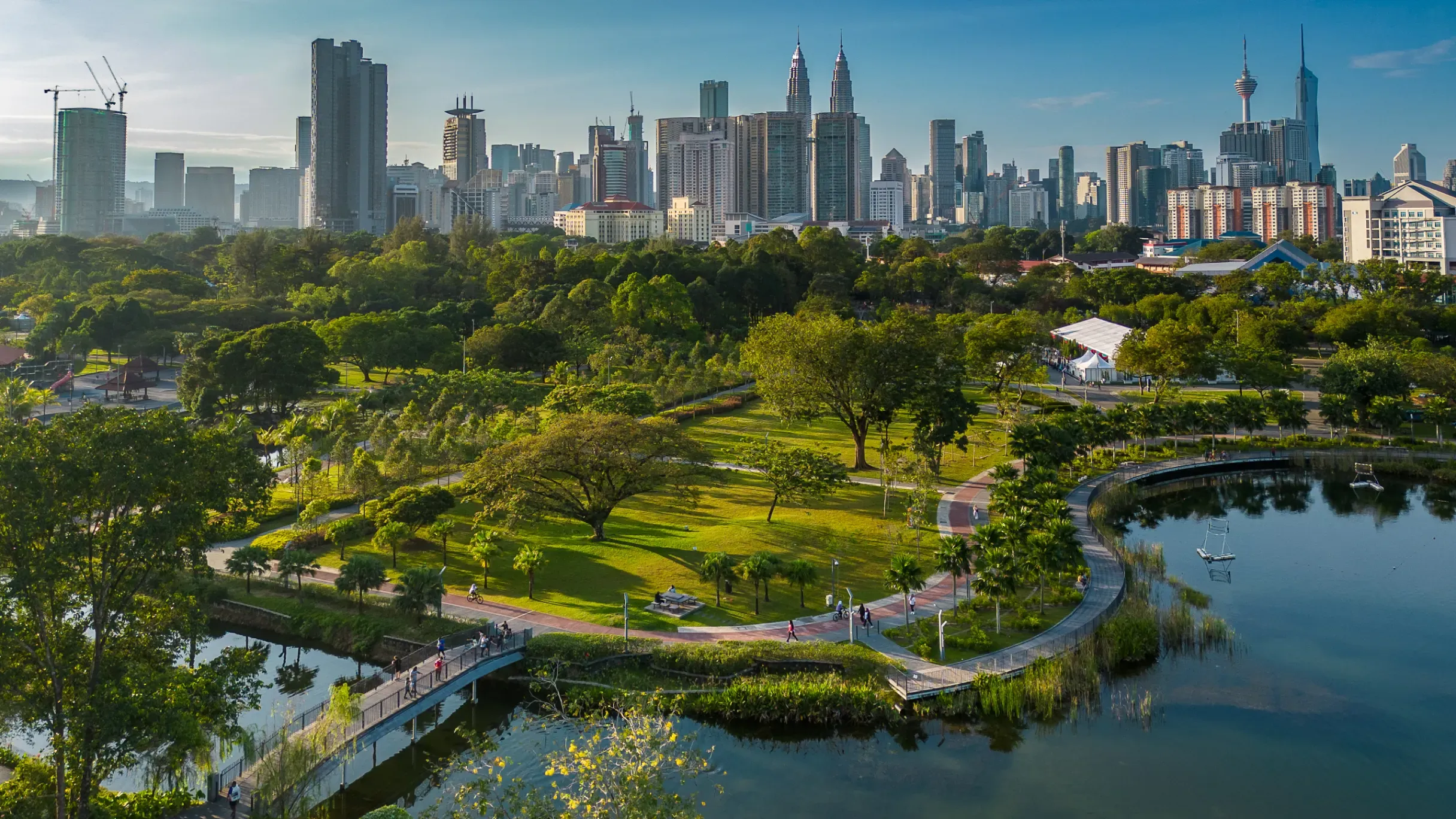 Kuala Lumpur’s Titiwangsa Recreational Park featuring landscaped green spaces, walking paths, and views of the city skyline. 