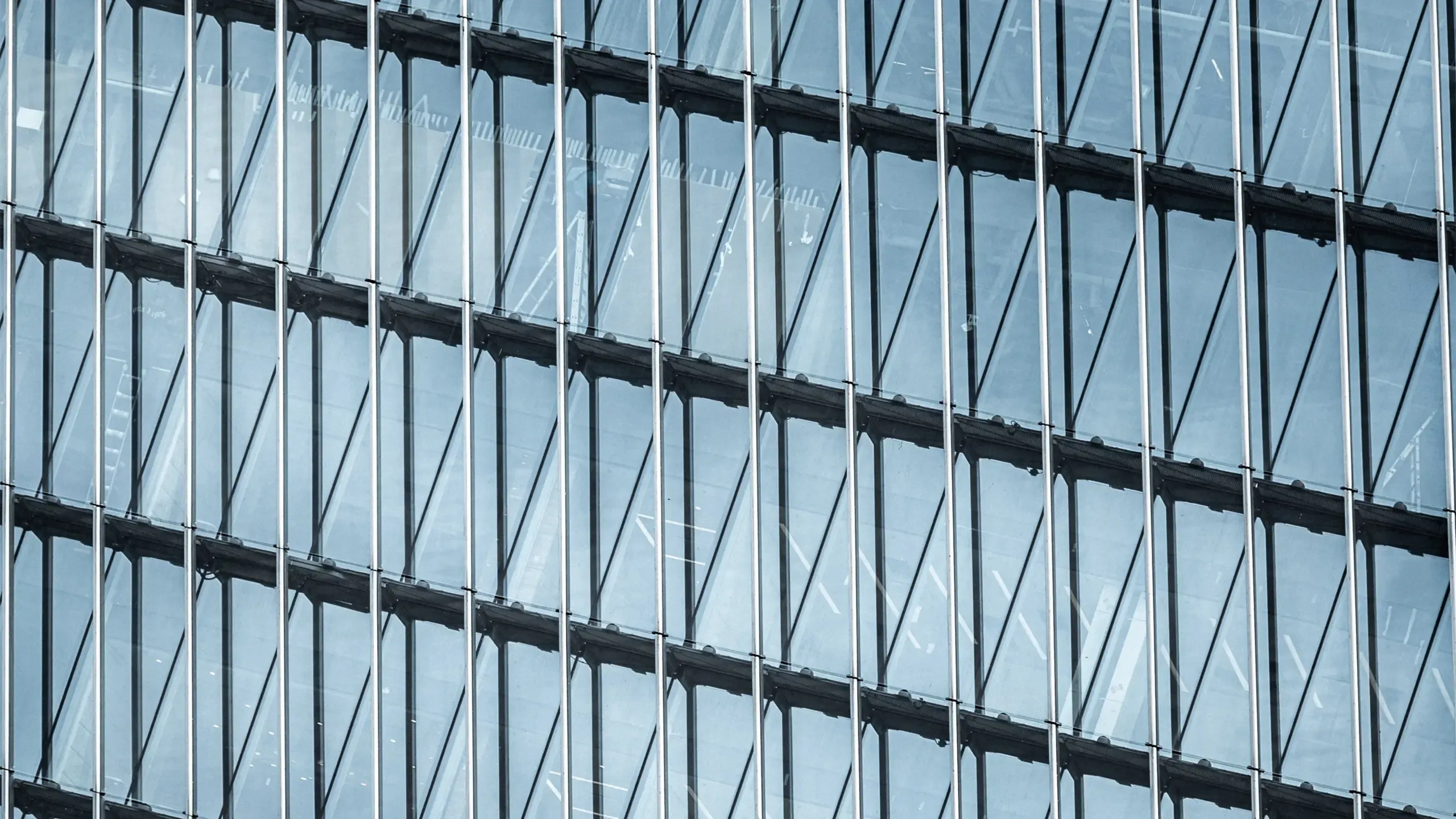 Modern office exterior facades with clouds reflections