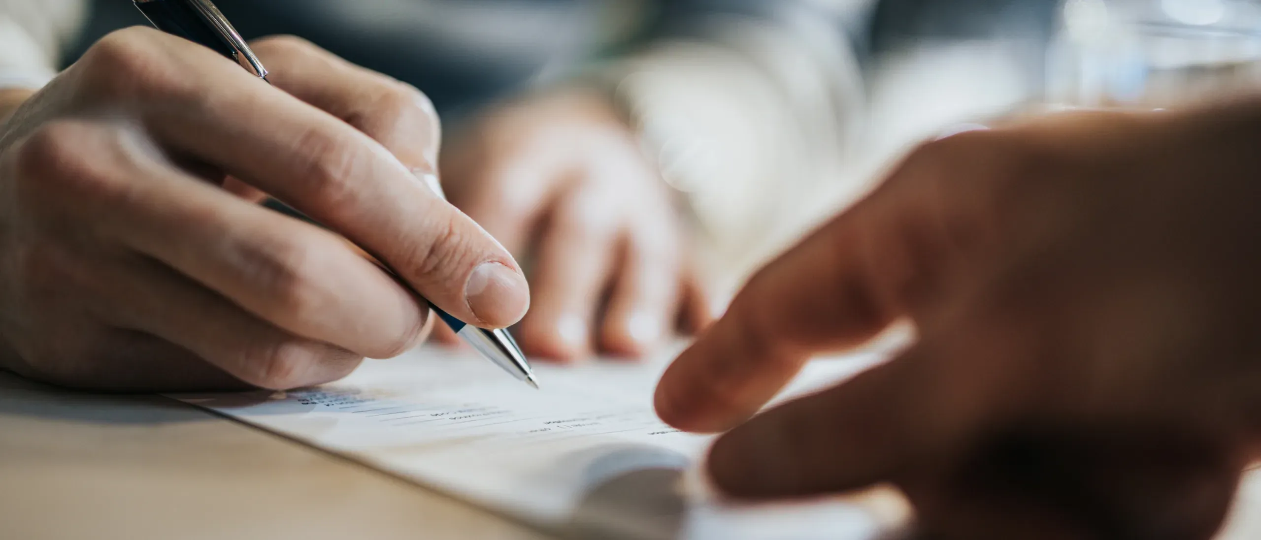 a person signing a document