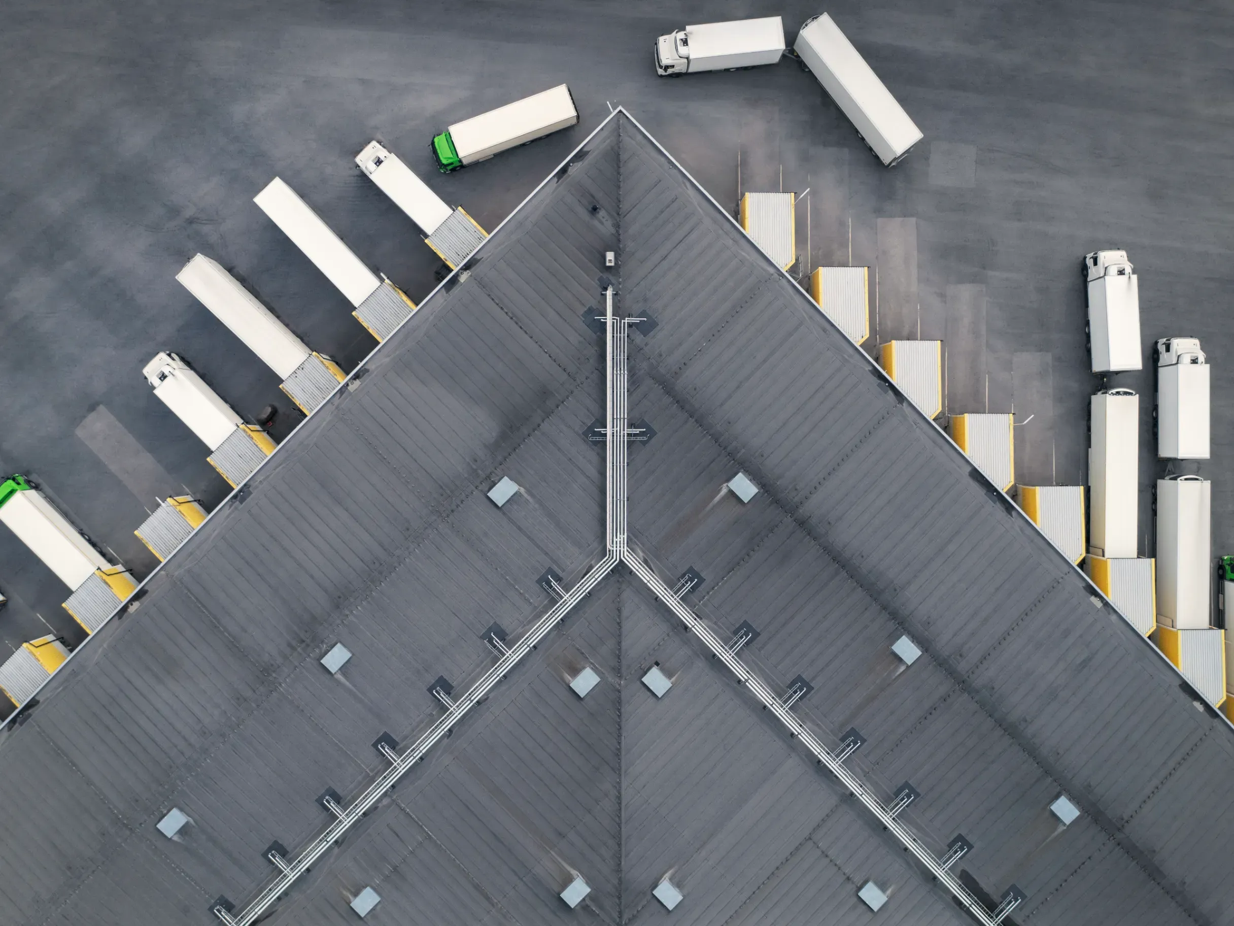 Overhead view of a logistics facility showing warehouses and loading areas. 