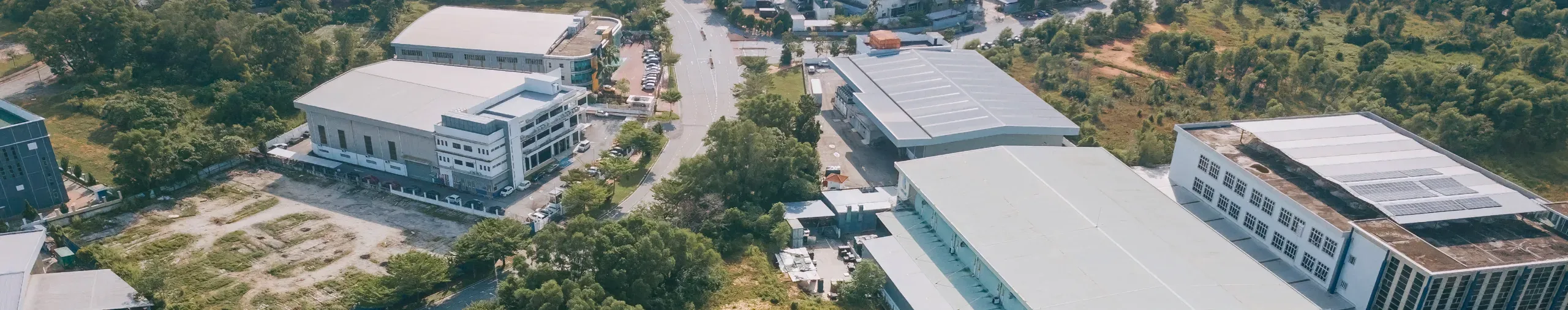 Aerial view of an industrial area showing facilities, and surrounding infrastructure. 