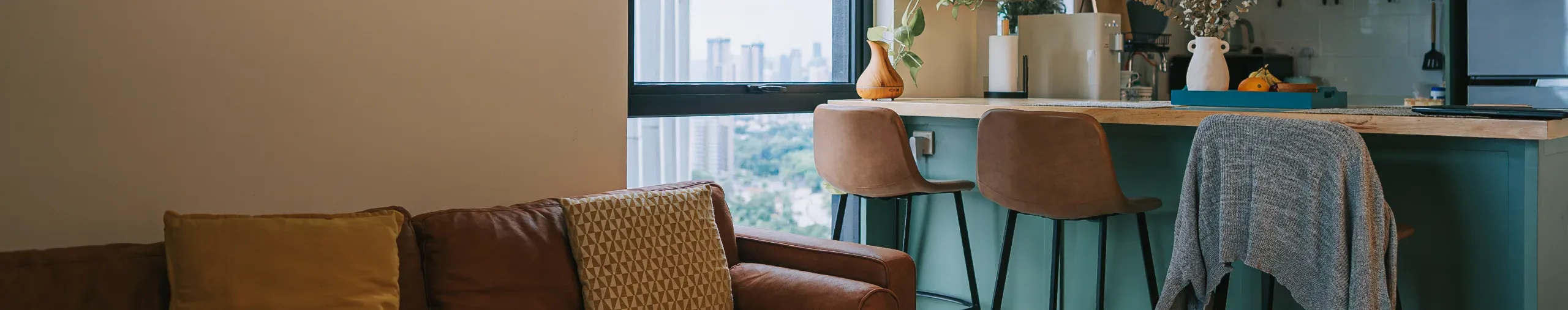 cozy studio apartment with sofa and kitchen island