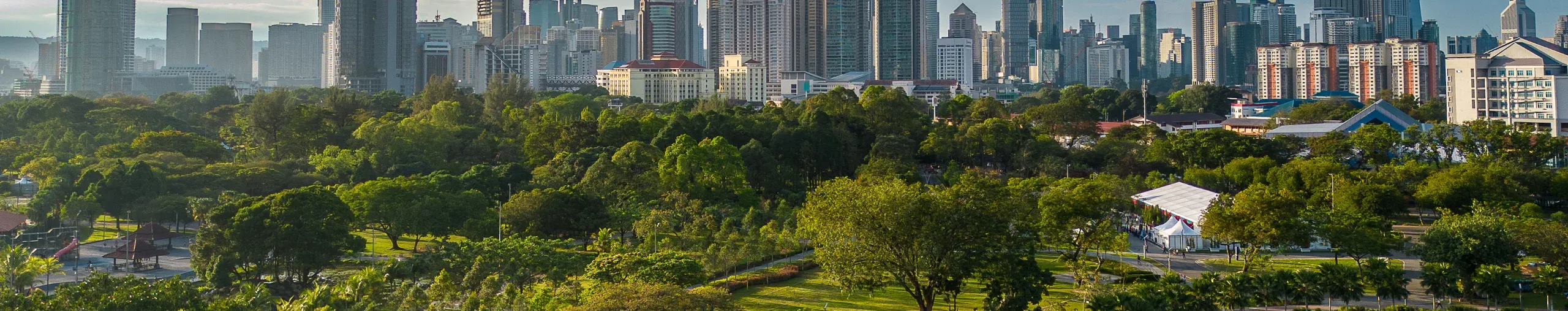 Kuala Lumpurs Titiwangsa Recreational Park featuring landscaped green spaces walking paths and views of the city skyline