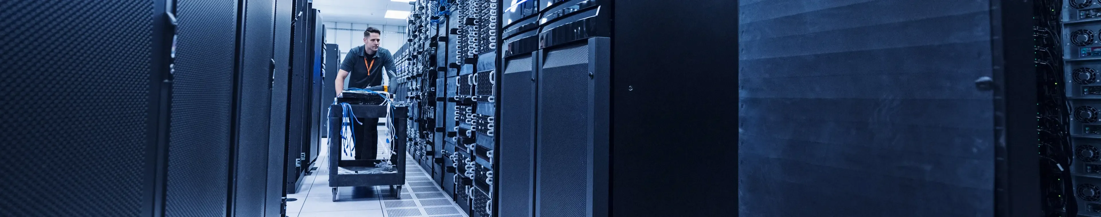 man working in server room